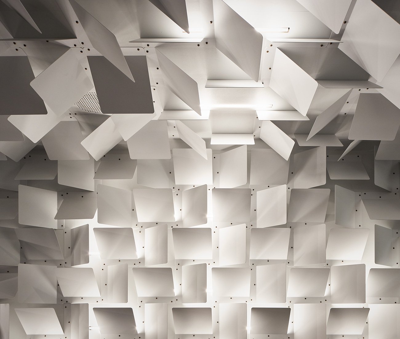 powder-coated folded metal panels that wrap around the walls and ceiling