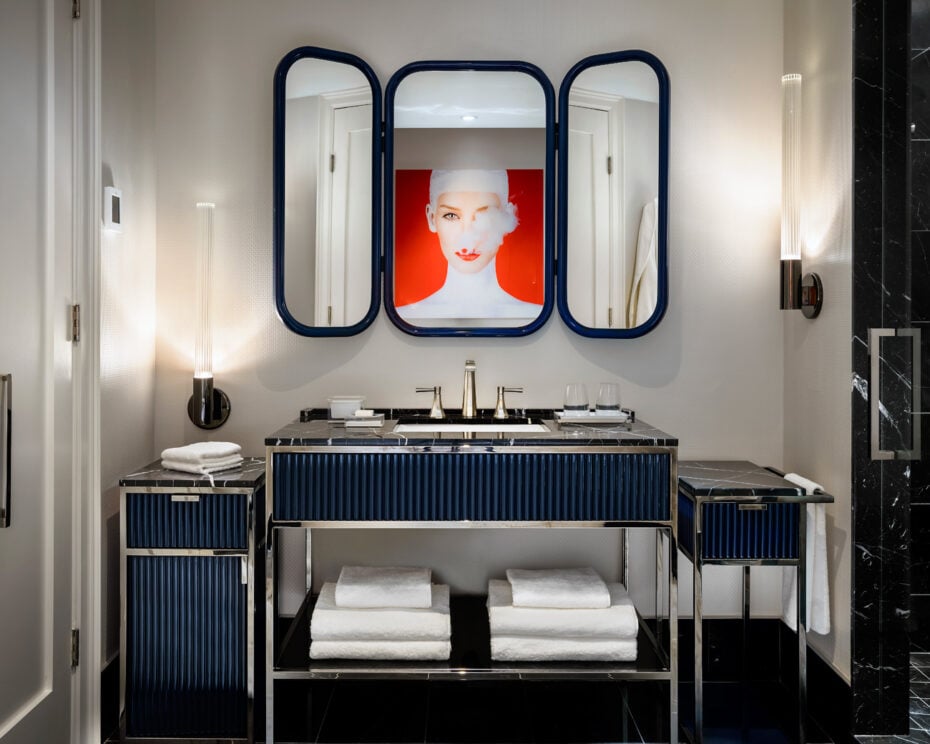 Brushed nickel sink with custom vanity in Bisha Hotel bathroom design by Studio Munge