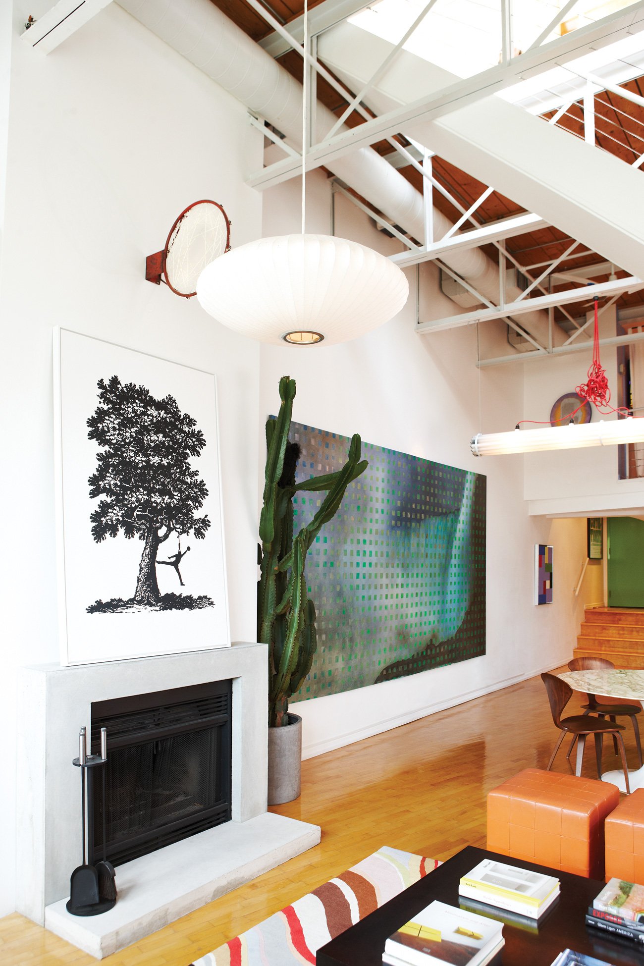 fashion district loft toronto Fashion District Loft with Art on mantel with dreamcatcher and abstract painting on wall.