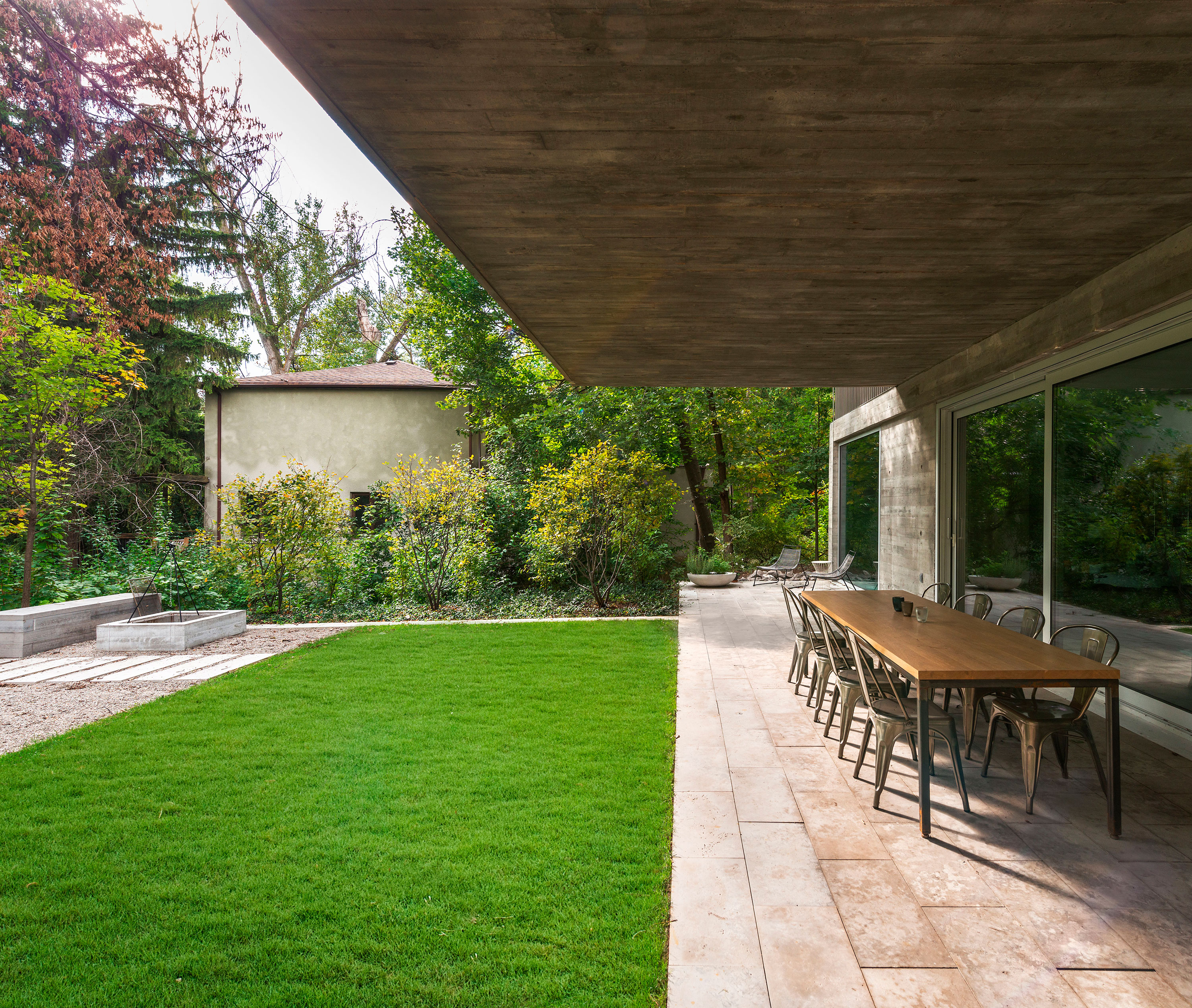 Outdoor landing connecting a cantilever home to a lush yard and Don Valley ravine.