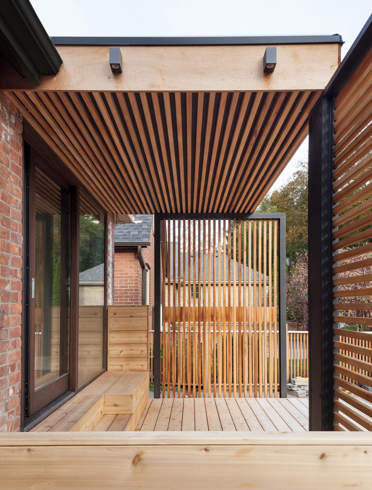 cedar deck with slatted screens enclosing the space