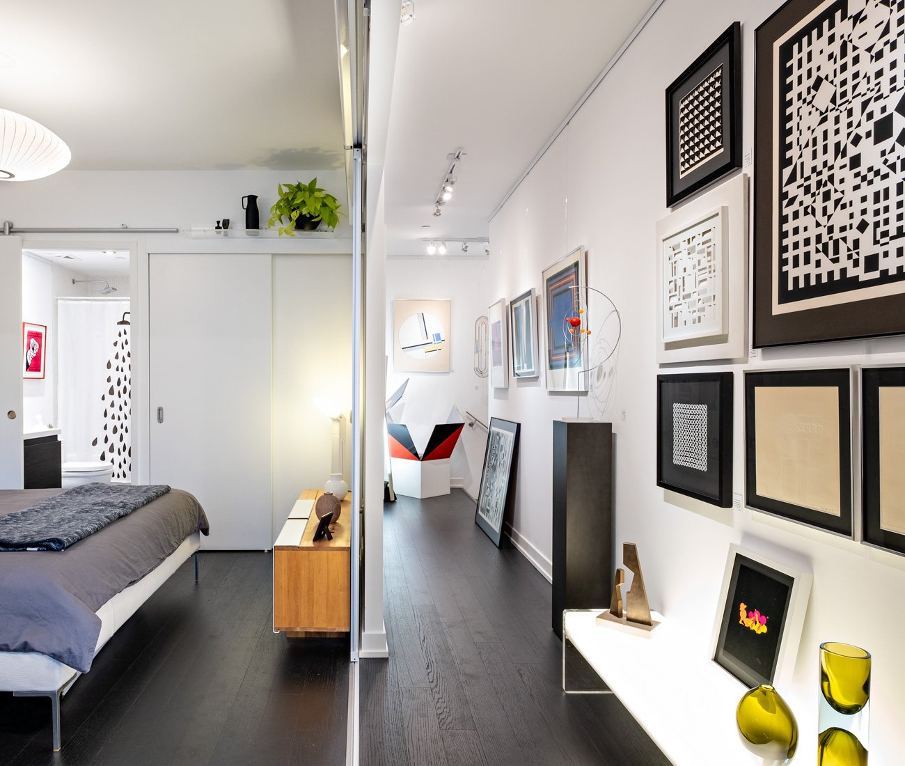 Atomic Design Condo - Glass pocket doors separate the bedroom from the living room and hallway.