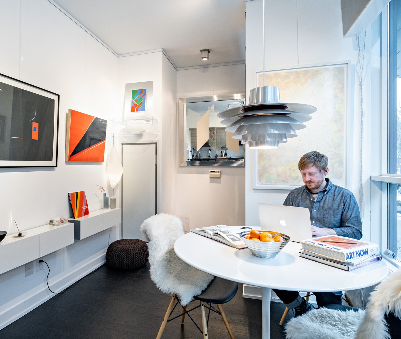 Lawrence Blairs sitting at his condo dining table