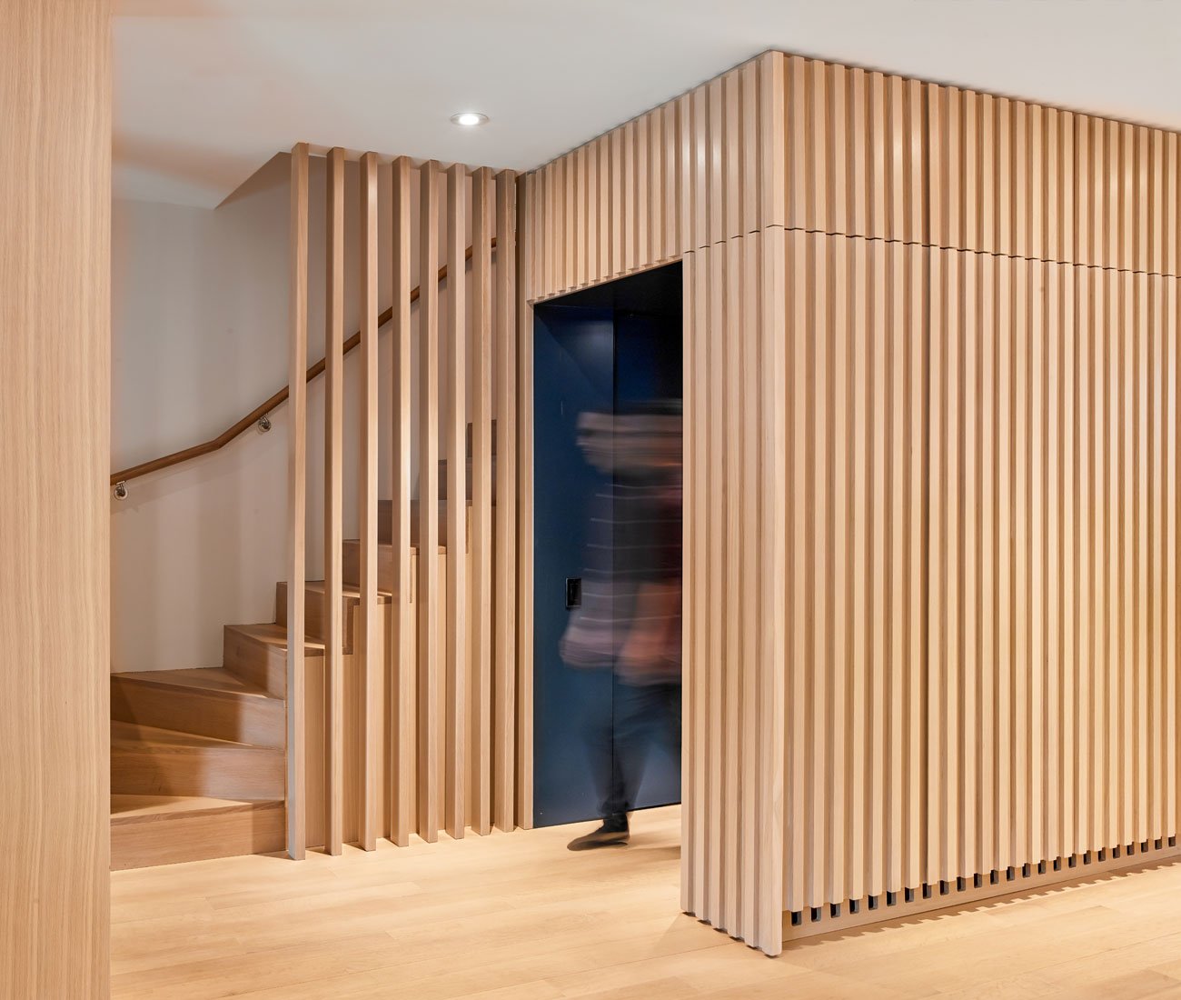 Slatted white oak design by architect Vanessa Fong for a renovation of an Edwardian home in Toronto.