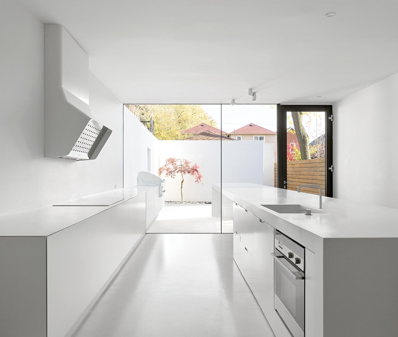 Johnson Chou Corian white kitchen