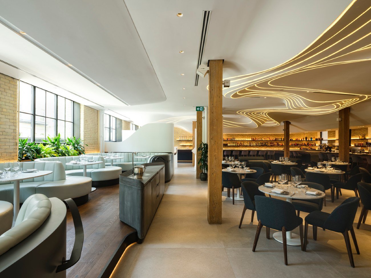 mix of seating space areas at Vela restaurant in Toronto