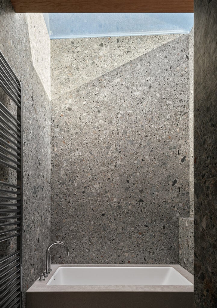 Ceppo Stone and Skylight above bathtub