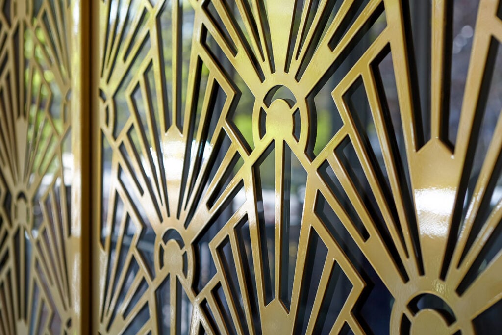 Detail of brass-style wall decoration at Ravina House