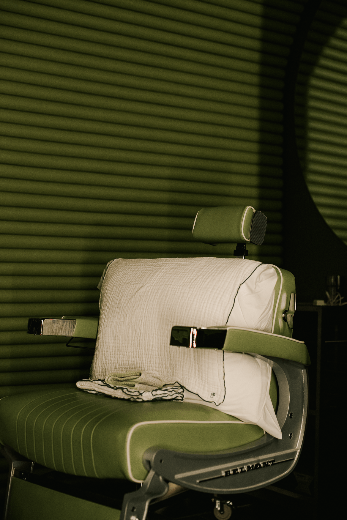 Green barber style Chair in a spa